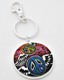 Add some flair to your keys with this groovy dual-faced keychain! One side features two colorful peace signs with wings, while the other side is engraved with the words “Imagine” and “Peace” around another peace sign. Its tight-fitting clasp keeps your keys close together and organized, while its unique design makes it fit nicely in your pocket or purse. Pair it with our “Flying Heart Keychain” to complete the set!