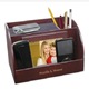 Great for the multi-cell phone family, this electronics charging station provides an organized way to store multiple mobile devices. Wires and cords are kept tucked away and out of sight, while your mobile devices have a "home". This beautiful rosewood charging station is lined in a soft fabric to protect items. Charging station also has a decorative 3 1/2" x 4" photo frame, making it an attractive yet functional gift. Charging station measures 8 3/4" x 5 1/2" x 5 3/8". 