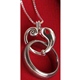Teardrop shaped  silver plated heart opens at top for attaching a wedding or other ring. Silver plated 18 chain. 