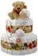 Sports fans will love this diaper cake! Baby can train for the big leagues right in their own cradle with these adorable sports ball rattles and teethers. GUNDs Sport Ball Water Teether Ring and Pro-Grabbies Sports Ball Rattle adorns this 45 count diaper cake, topped off with GUNDs popular 9" plush bear, Schatzi! His oversized paws make for the cutest and snuggliest of friends.