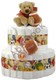 Sports fans will love this diaper cake! Baby can train for the big leagues right in their own cradle with these adorable sports ball rattles and teethers. GUNDs Sport Ball Water Teether Ring and Pro-Grabbies Sports Ball Rattle adorns this 45 count diaper cake, topped off with GUNDs popular 9" plush bear, Schatzi! His oversized paws make for the cutest and snuggliest of friends.