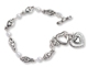 Our silver toned and pearl bracelet is a meaningful gift idea to give to someone very special. Heart Charm.