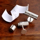 Your secret agent man will love these! Our personalized Secret Agent Cufflinks come in a handsome gift box and include a secret compartment! Unscrew these tubular-shaped silver-toned accessories and hide a personal note for the recipient. Send a secret message for your groom to be on your wedding day or send a love message to a special someone for an anniversary, birthday or even holiday gift idea. Stud design includes up to 3 initials. Measures 3/4" x 7/8" x 3/4" (diameter). Personalize with three initials.