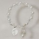 The Christening of your little girl or boy is a glorious day for the family. Honor this day and keep this treasured moment forever with an Engraved Baptism Bracelet created especially for your God Child. A loving gift celebrating the union with God. Your Personalized Pearl God Child Bracelet is pearl and clear Swarovski crystal with silver pendant. 4" or 5" is an infant size recommended for baptisms or christenings. Each bracelet includes an adjustable clasp that extends the bracelet another 1 - 1/2" - the 4" bracelet is 4" of beads and 1 - 1/2" of extender chain. Includes FREE Engraving. Personalize your Baptismal Bracelet with any initial. ( ie. T )