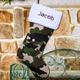 Santa is sure to know who the hunting fan is when you display this unique Embroidered Camo Christmas Stocking on the wall or fireplace mantel. Perfect for your lodge style home and looks great hung with your fantastic hunting trophies. Present your favorite hunter with a Personalized Christmas Stocking like this to make this Christmas one to never forget. Also makes a great gift for those serving in the military. Embroidered Camouflage Christmas Stockings is a polyester Stocking and features a front buttoned pocket to hide extra goodies. Each Stocking measures 17" long and includes FREE Personalization! We will embroider the white cuff with any name in brown thread.