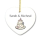 Newlyweds will love this ornament, and remember it fondly when hung up on their tree year after year. Our beautiful heart shaped ornaments are made of white porcelain. They all comes with a gold hanging cord, and measure 3" x 2 3/4". Personalization Information: Personalize this gift with the couples names and a year.