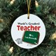 Give your teacher a gift that truly comes from the heart with our Worlds Greatest Teacher Personalized Ornament. Our Worlds Greatest Teacher Personalized Ornament Keepsake is the perfect gift for a Teacher Appreciation Gift, Christmas Gift or just because. Our Worlds Greatest Teacher Ceramic Ornament is a flat ornament and measures 2.75" in diameter. Each Ornament includes a ribbon loop to easily hang from your Christmas tree. Includes FREE Personalization! Personalized with any name.