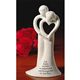 Good wishes will ring in the ears of a special couple! Crafted of ceramic in seamless detail, the bell is inscribed with a loving sentiment. Comes in a gift box with magnetic closure. 7 3/8" high 