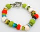 Get warm this fall with our colorful new bracelet. Our felt bracelet is sure to add some texture and color to your wardrobe. Made with felt beads, antique silver beads and glass beads. 