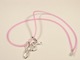 Our fun and trendy Love necklace is a sterling silver charm and a pink rubber (neoprene) necklace. Finished with sterling silver ends and a lobster clasp. Unlike rubber, the neoprene necklace will not burn or tarnish silver.