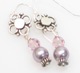 Our Pearl Danglers are available in a vareity of colors to accent any outfit. Made from swarovski pearls and swarovski crystals and sterling silver earring. Available in: Purple, Pink, Navy or White
