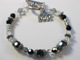 This silver, black and white bracelet is made with swarovski crystals and sterling silver. A graduate cap hangs next to the toggle. A great gift idea for someone graduating high school or college.